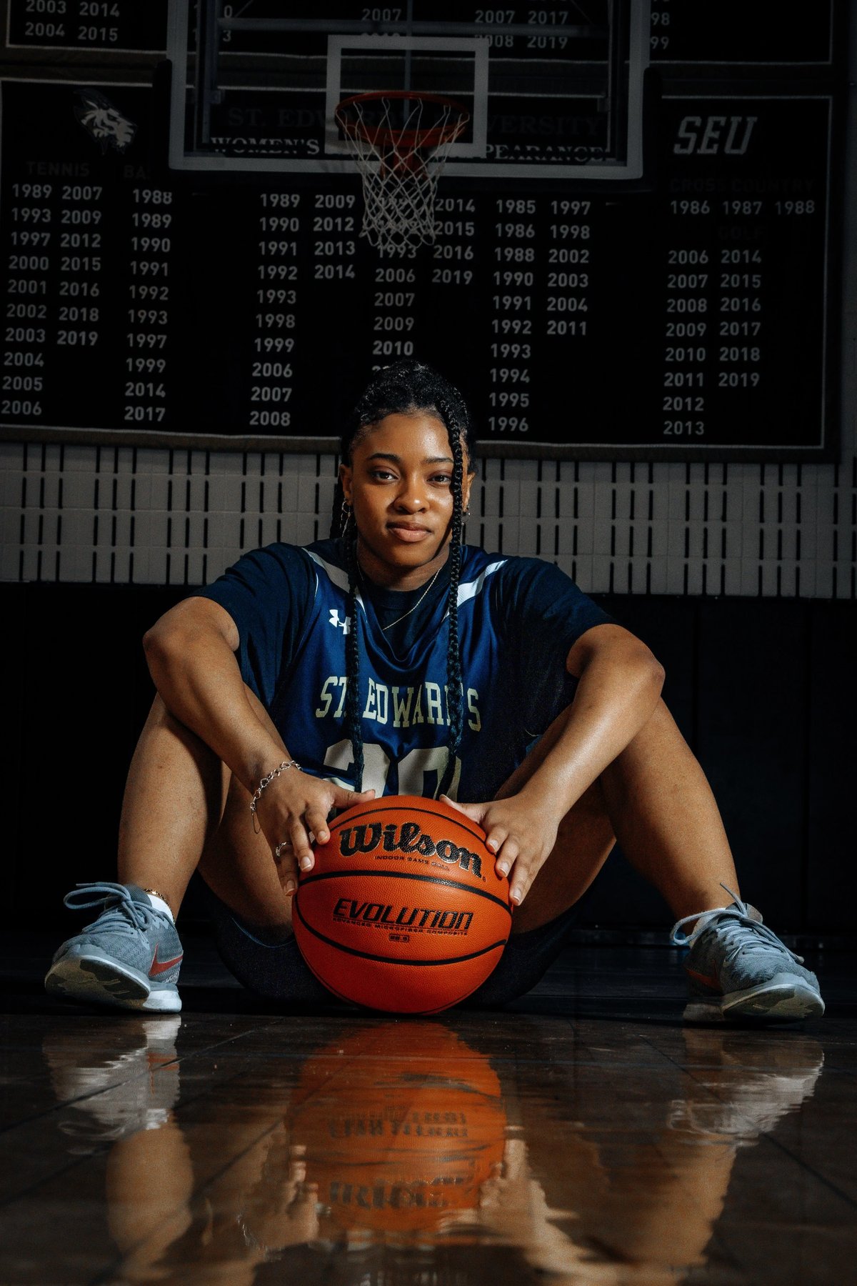 Athlete seated with ball